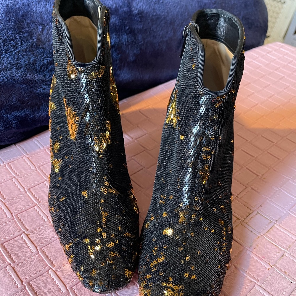 Stunning AUTHENTIC Christian Louboutin ankles boots for sale.